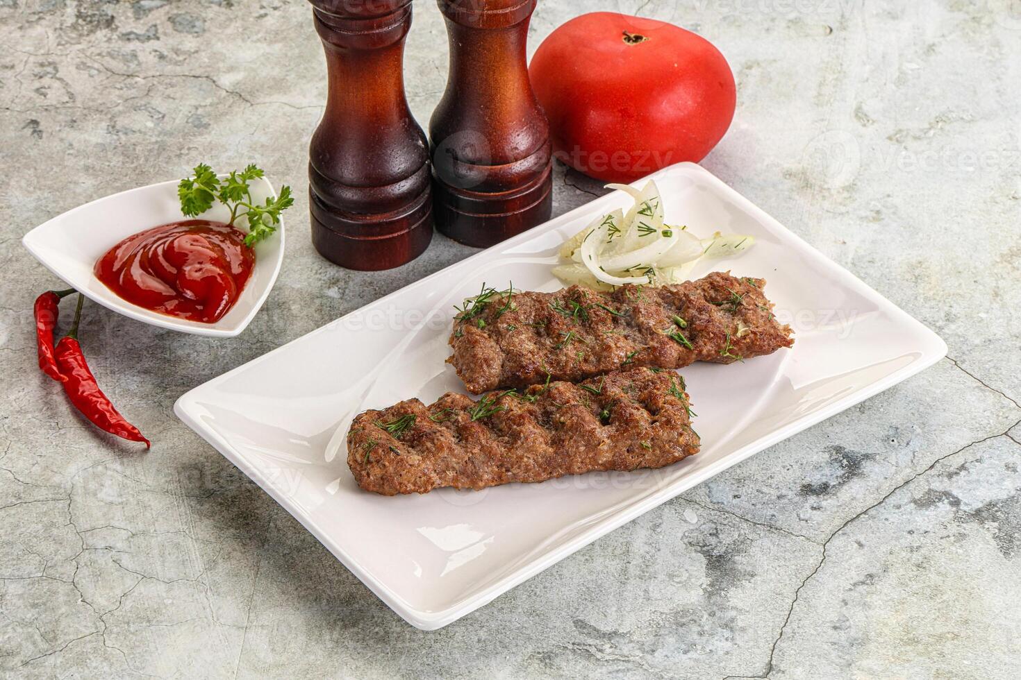 Kebab with beef served onion photo