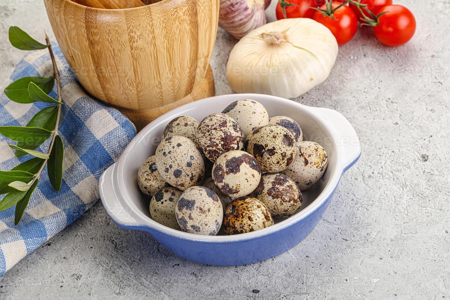 Raw quail eggs in the bowl photo