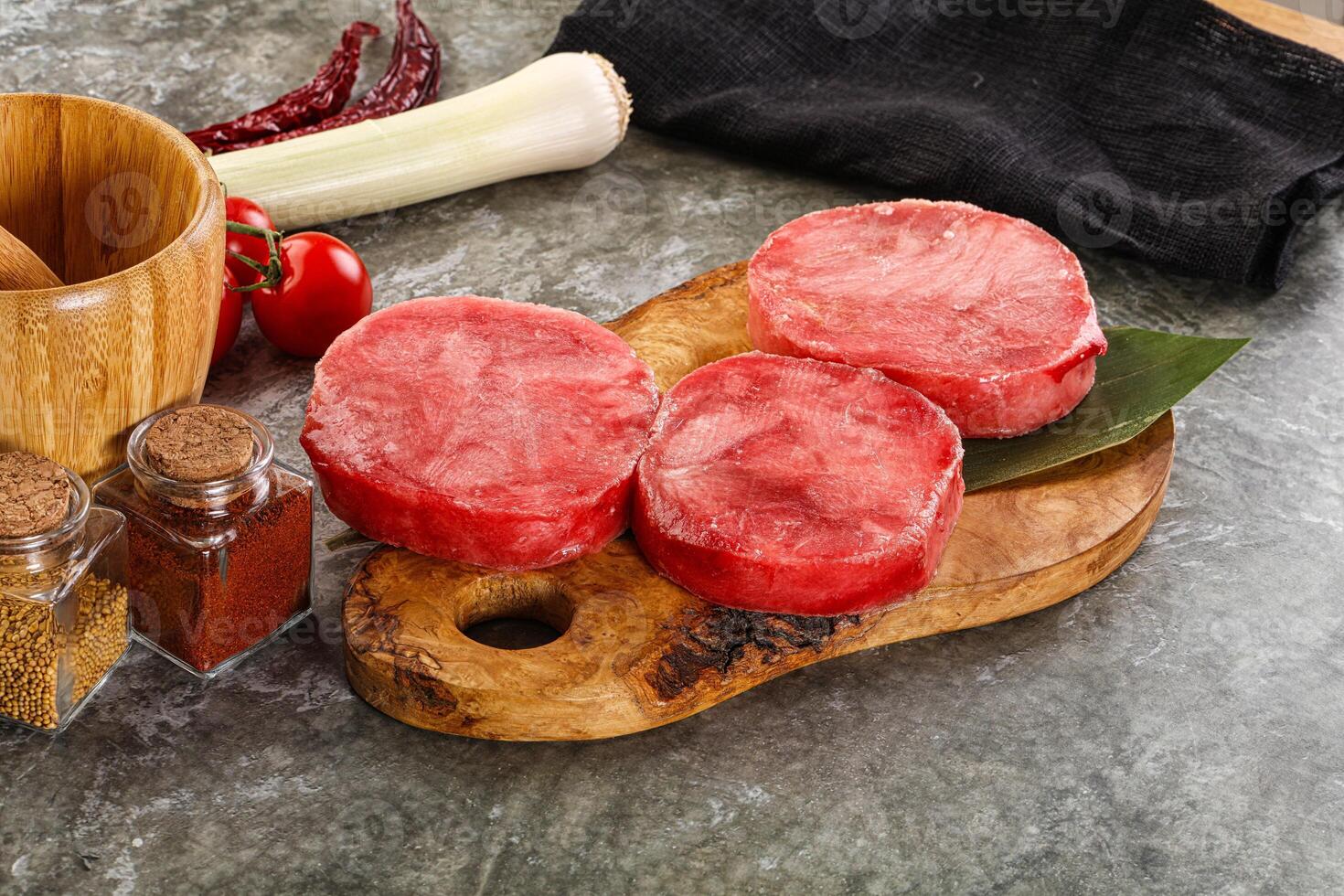 Delicous raw tuna medallion for cooking photo
