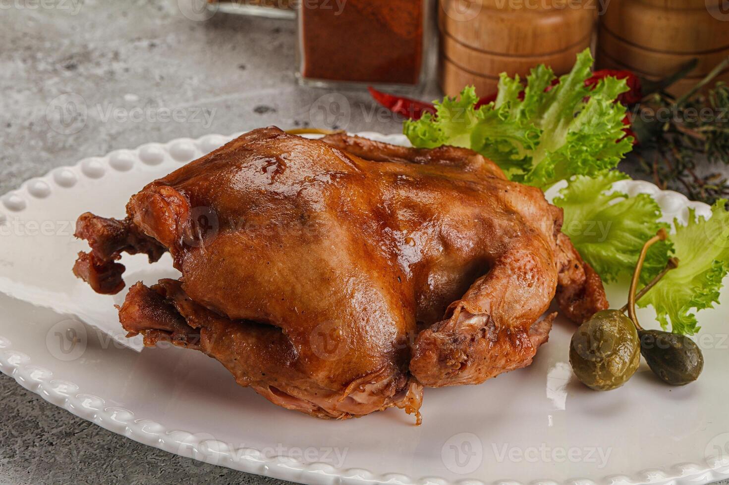 Baked small chicken with spices photo