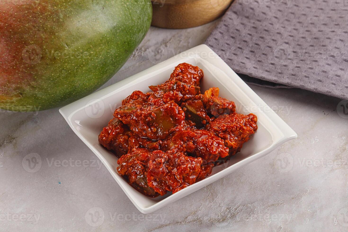 Spicy pickled raw green mango photo