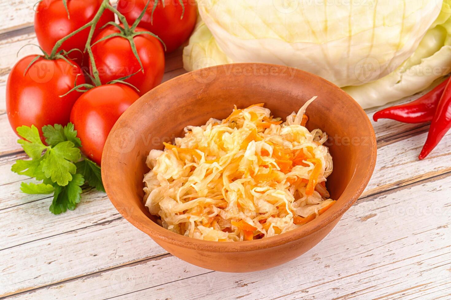 Fermented cabbage sauerkraut in the bowl photo