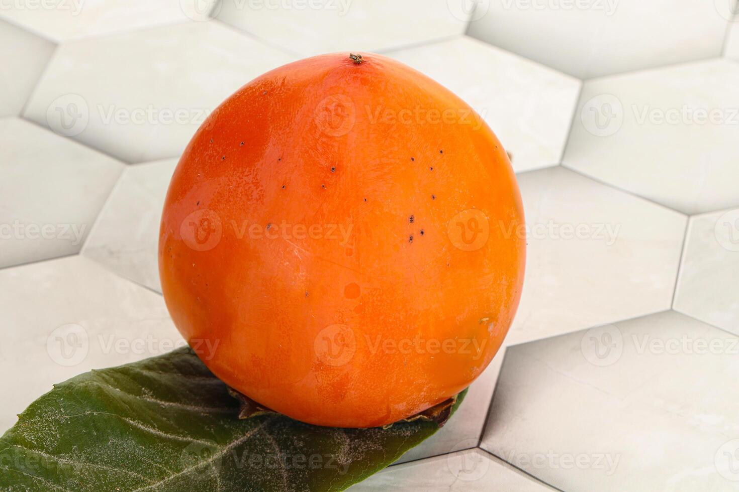 Fresh ripe sweet juicy persimmon photo