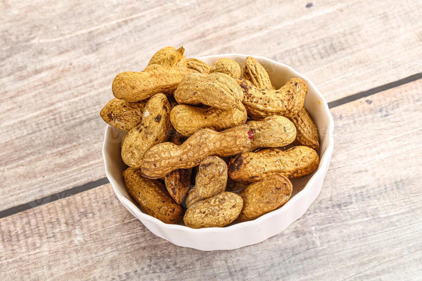 Raw ripe unpeeled peanut heap photo