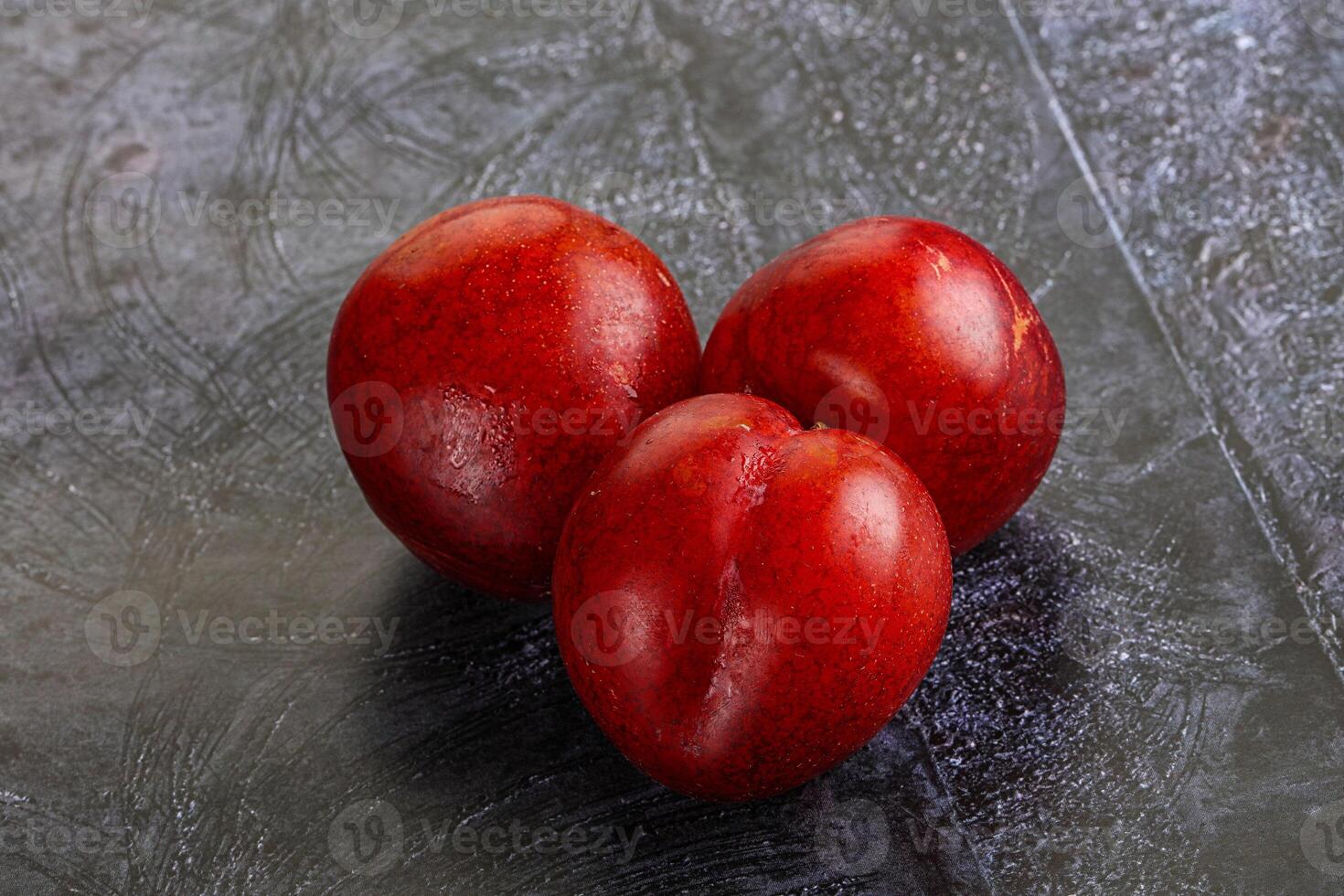 Ripe sweet juicy red plum photo