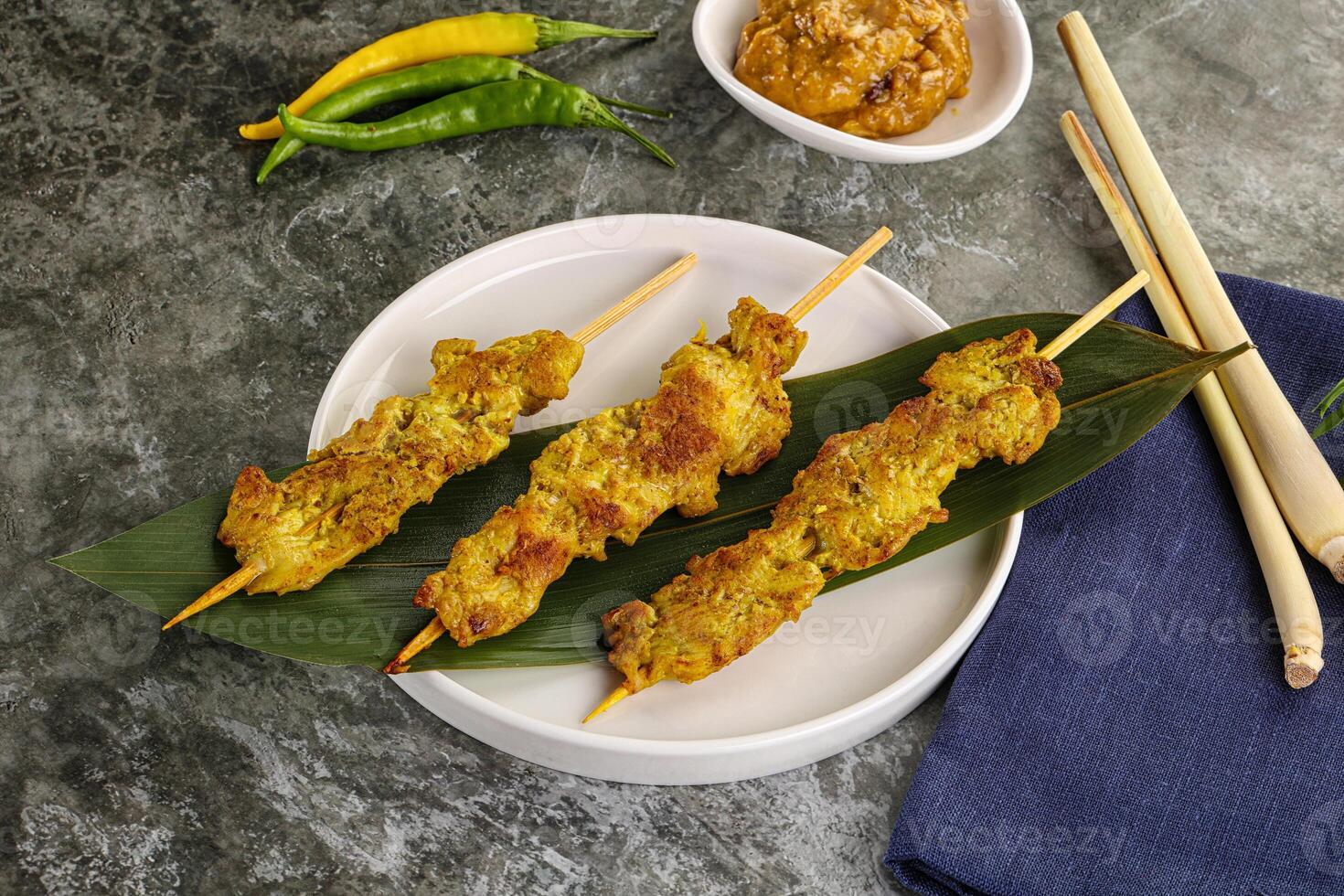 Thai meat skewer Satay with sauce photo