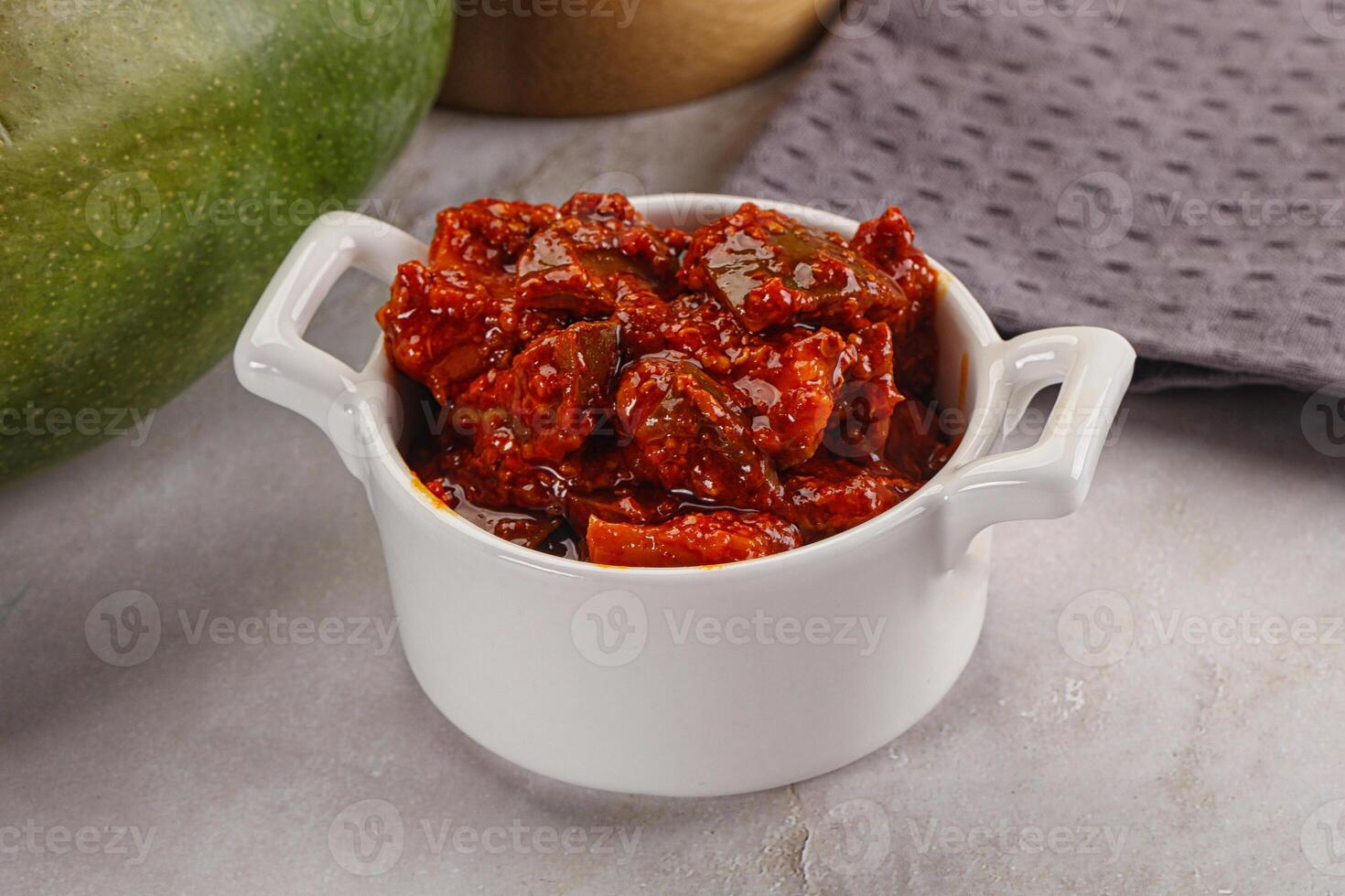 Spicy pickled raw green mango photo
