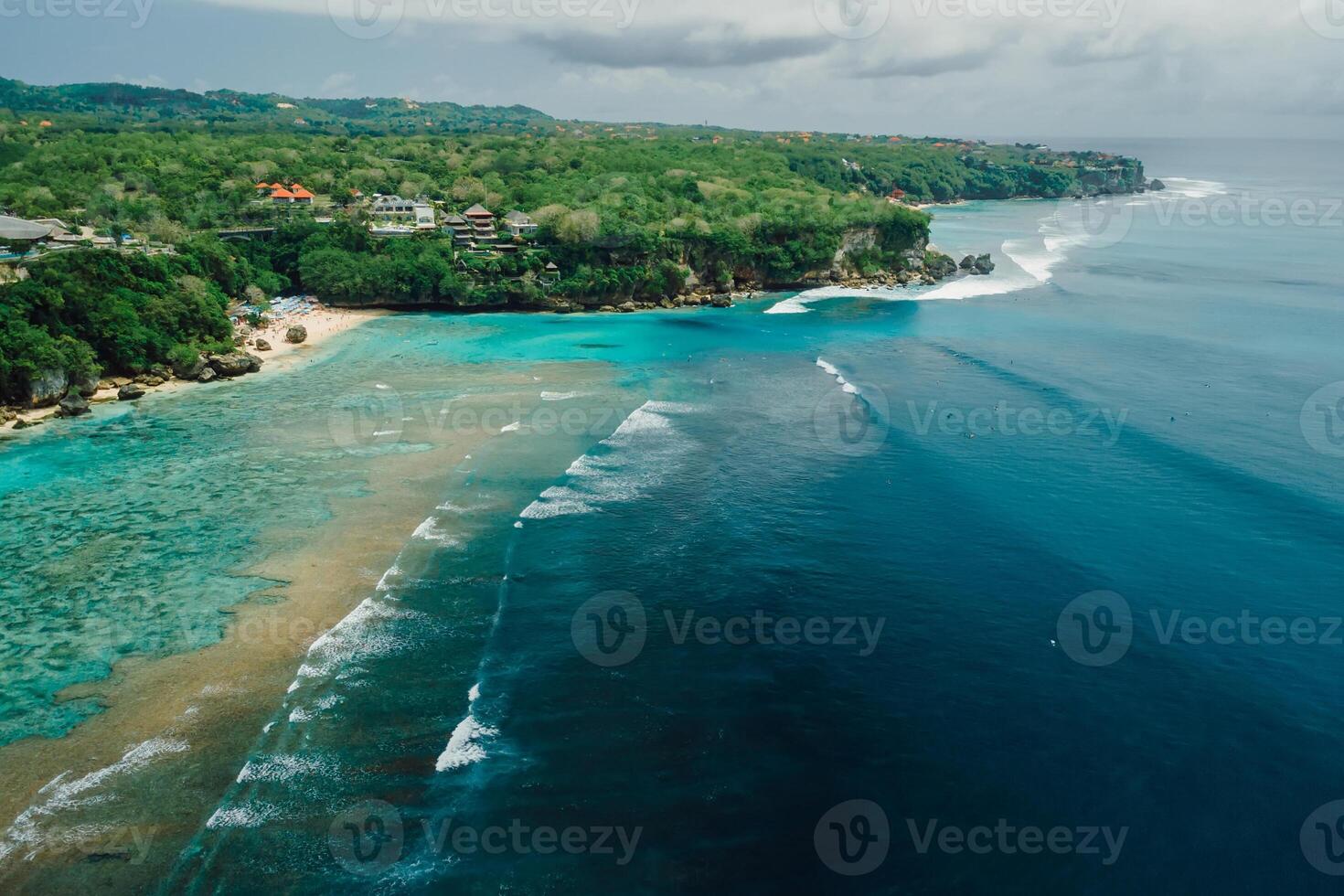 Aerial view of ocean with waves and coastline on Padang Padang beach in Bali photo