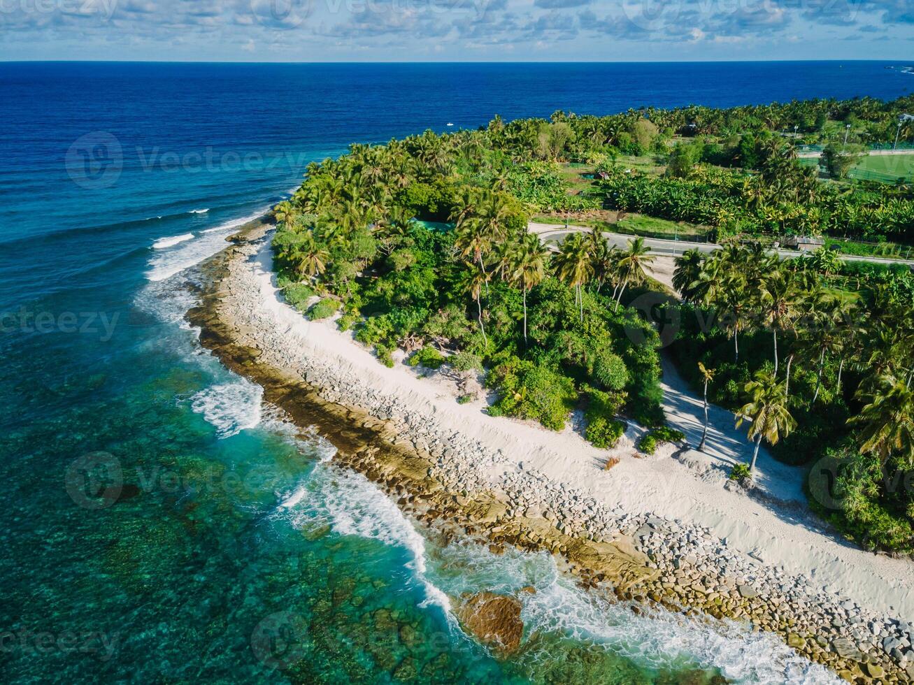Maldives island ocean beach with palms trees. Tropical banner. Aerial view photo