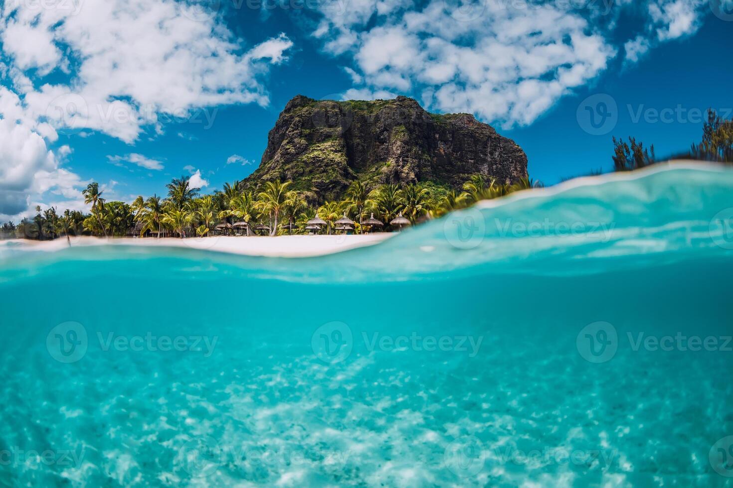 Tropical transparent ocean with Le Morne mountain and luxury beach in Mauritius. Split view. photo