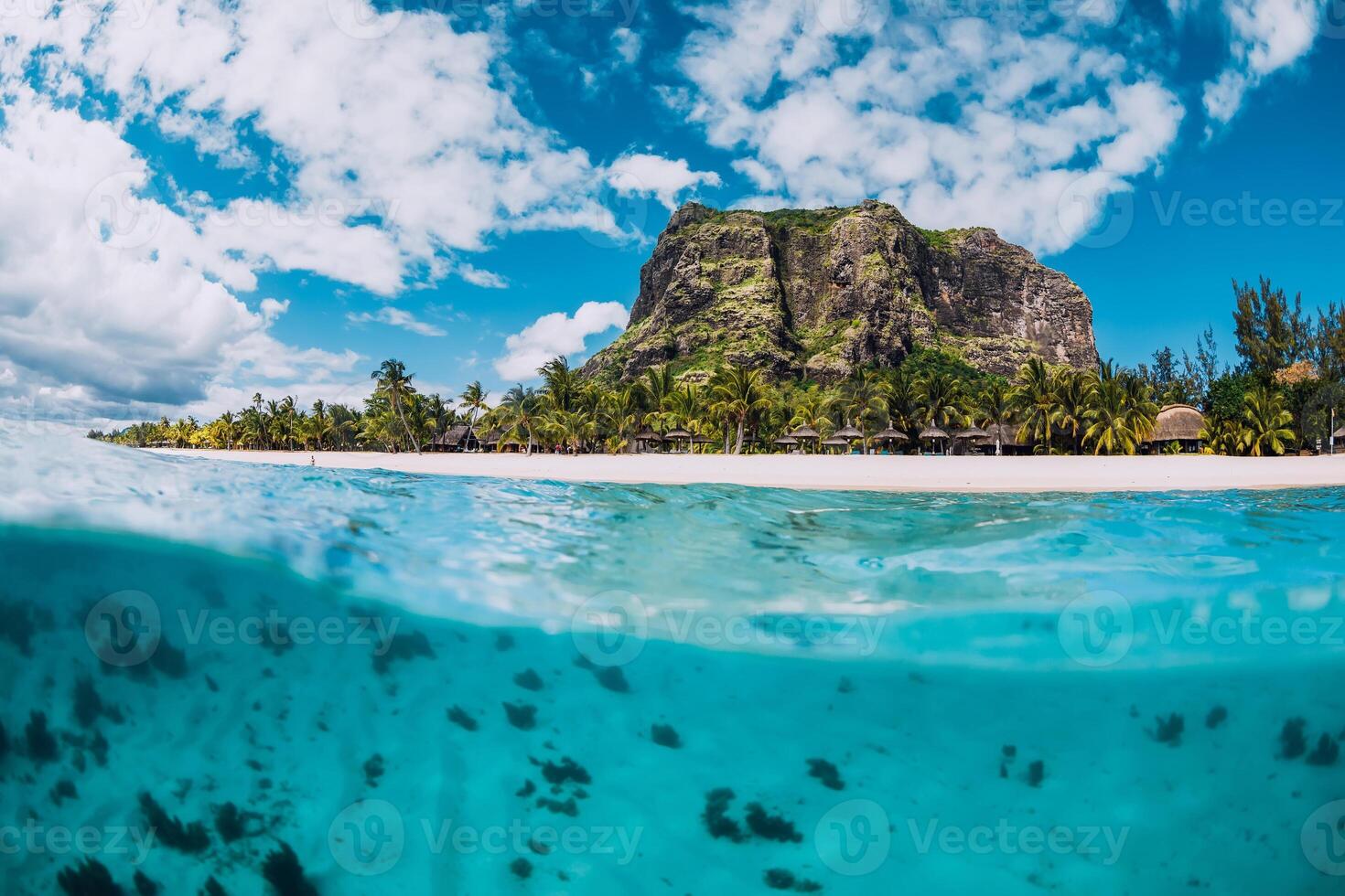 Tropical transparent ocean with Le Morne mountain and luxury beach in Mauritius. Split view. photo