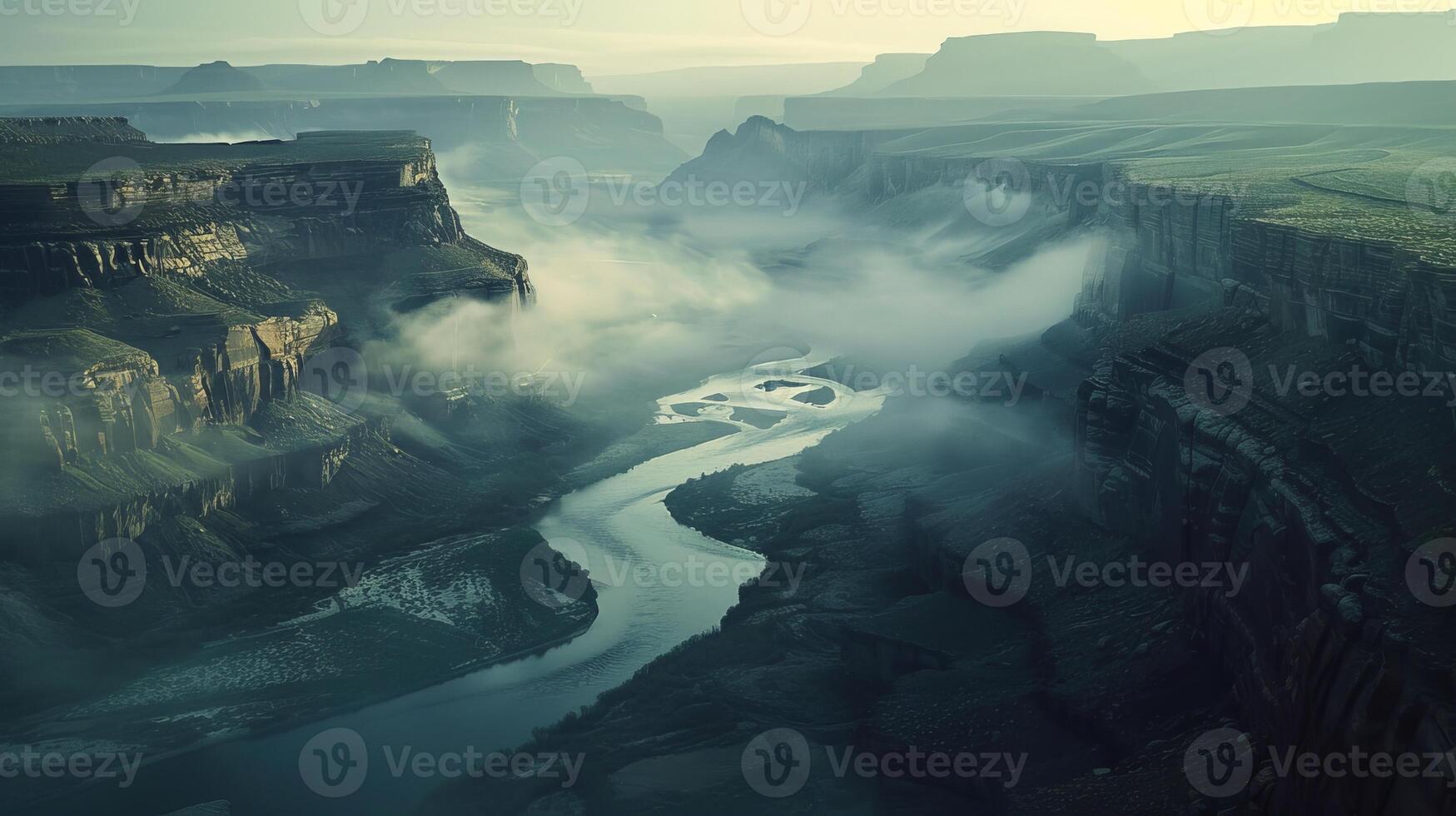 an aerial view of a river flowing through a canyon photo