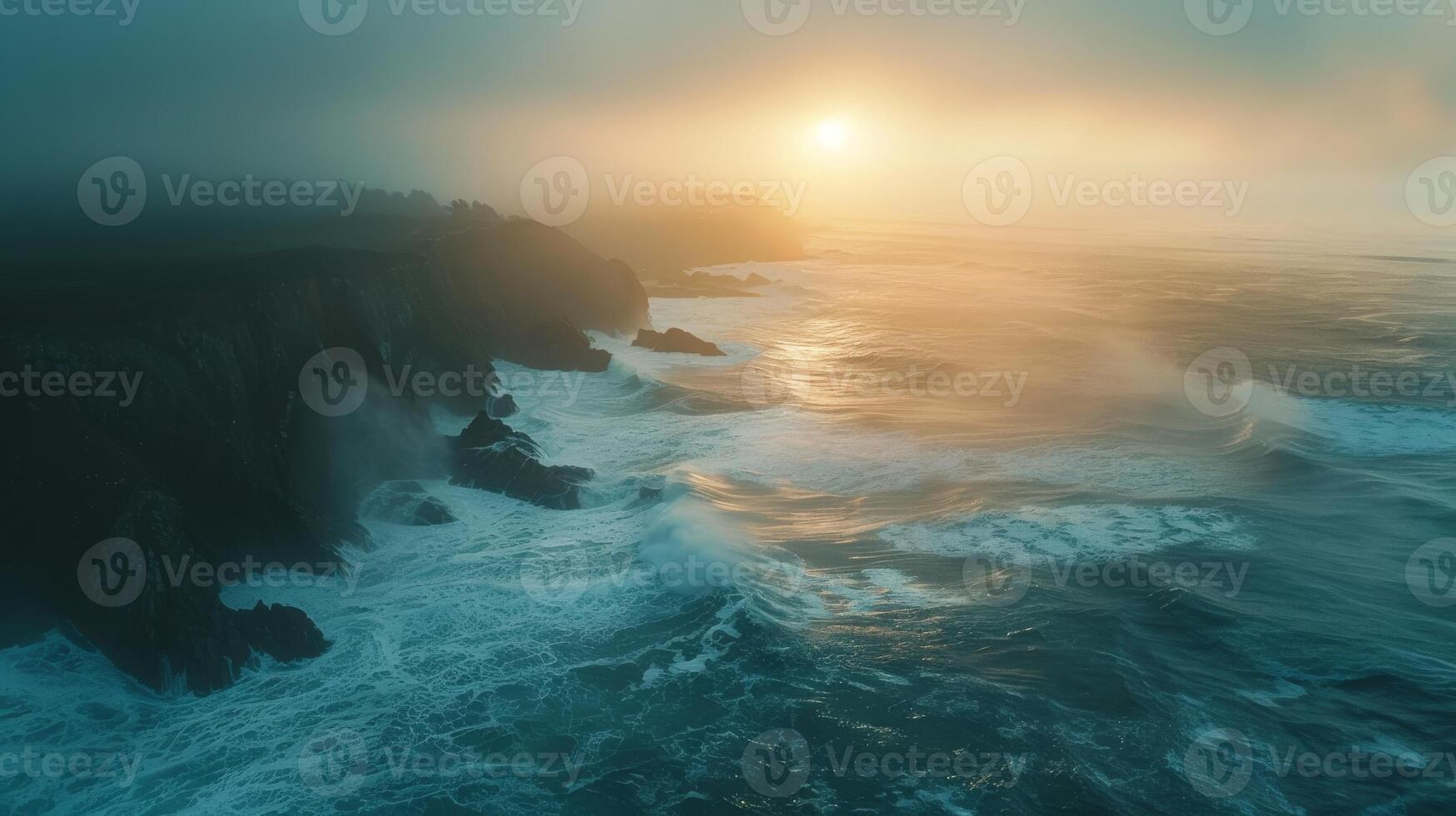 Ocean cliff at sunset with beautiful sky, clouds, and water below photo