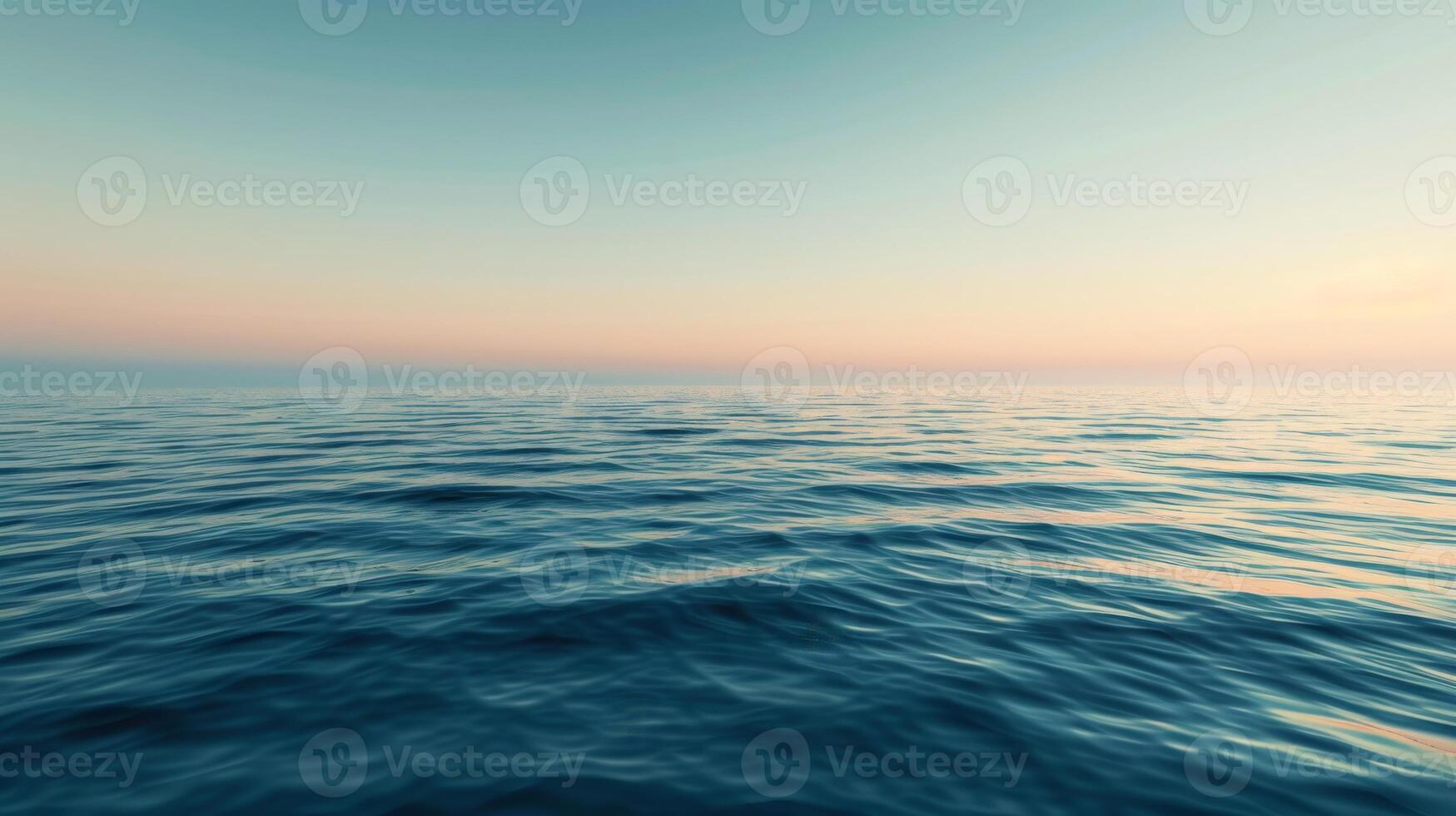 Blurry sunset sky reflected on fluid surface of large body of water photo