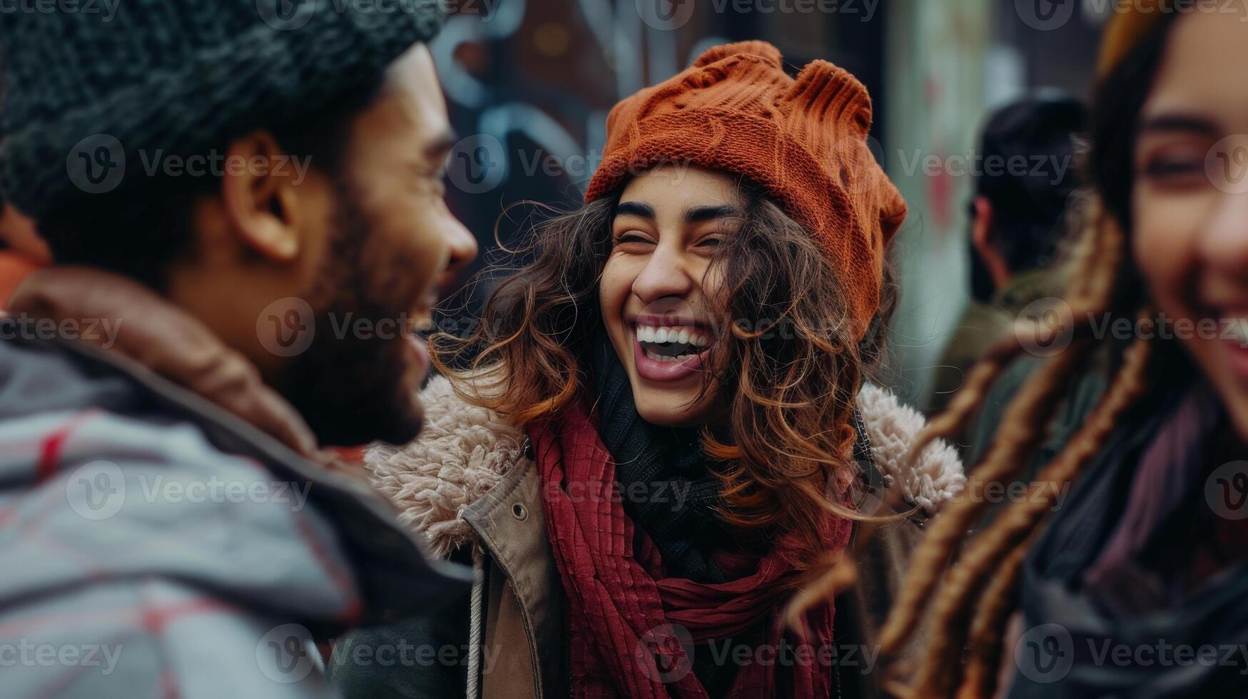 A crowd of people wearing hats and sharing laughter at an event photo