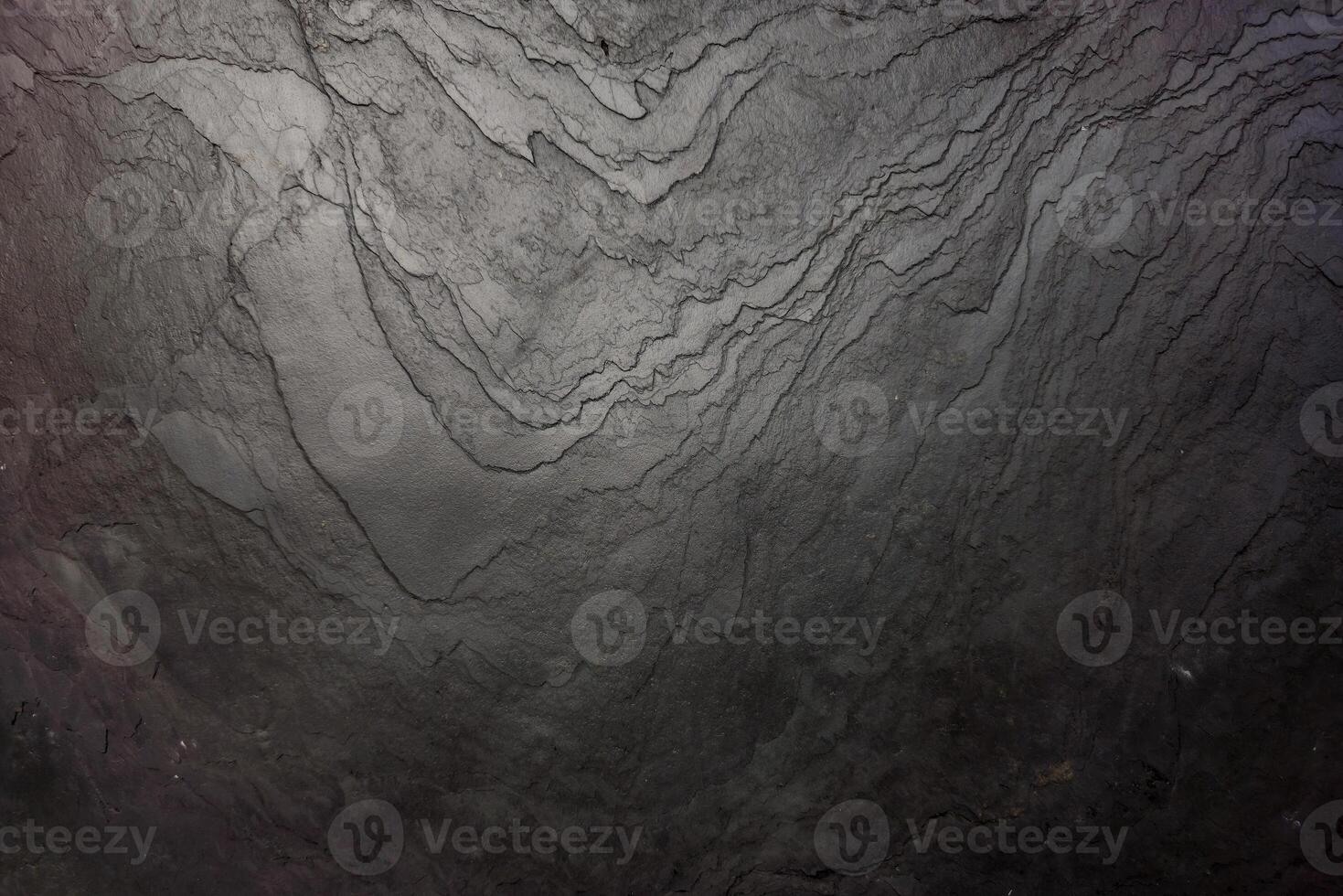 Black stone wall texture for background. photo