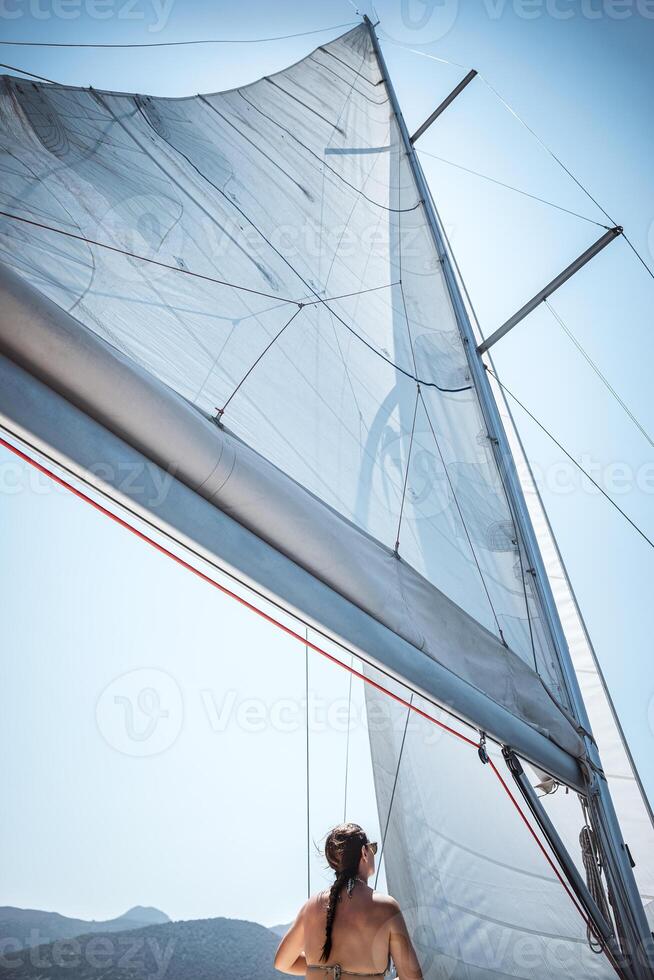 Girl Resting under White Sails photo