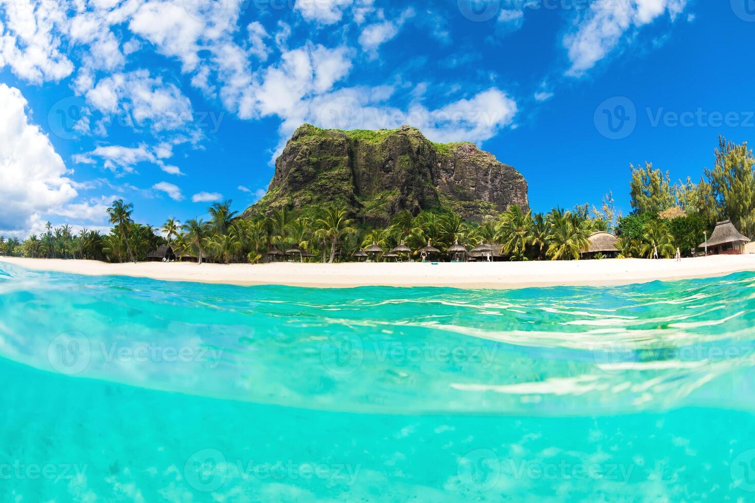 Tropical ocean with Le Morne mountain and white sand beach in Mauritius. photo