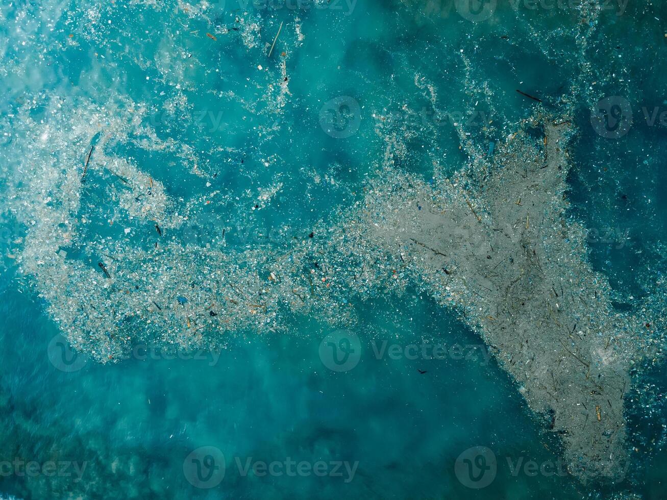 Ocean water and plastic trash island. Aerial view of pollution by rubbish photo
