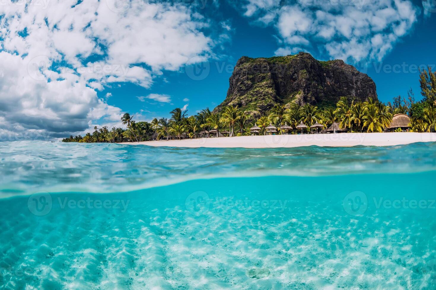 Tropical transparent ocean with Le Morne mountain and luxury beach in Mauritius. Split view. photo