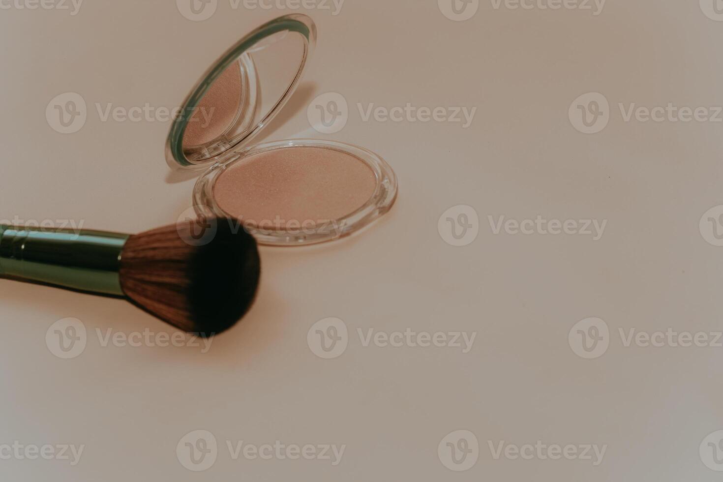 Green make-up bones on a light background with a highlighter. photo