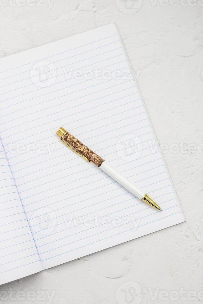 The pen lies in the notebook, the concept of study, time management. photo