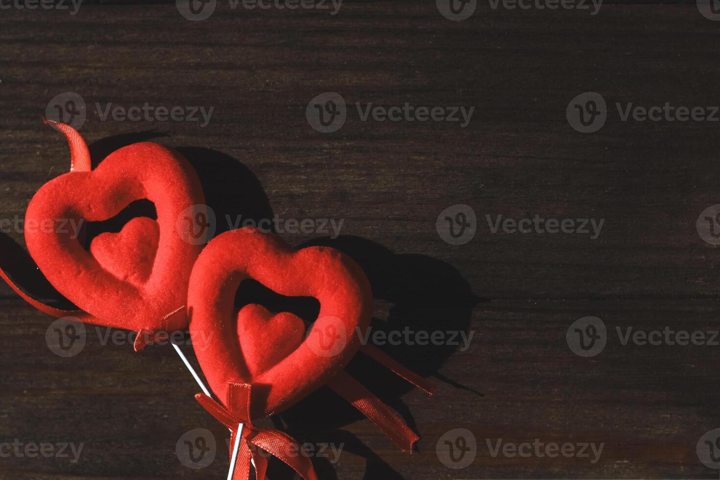 Decorative red ornaments in the shape of hearts photo