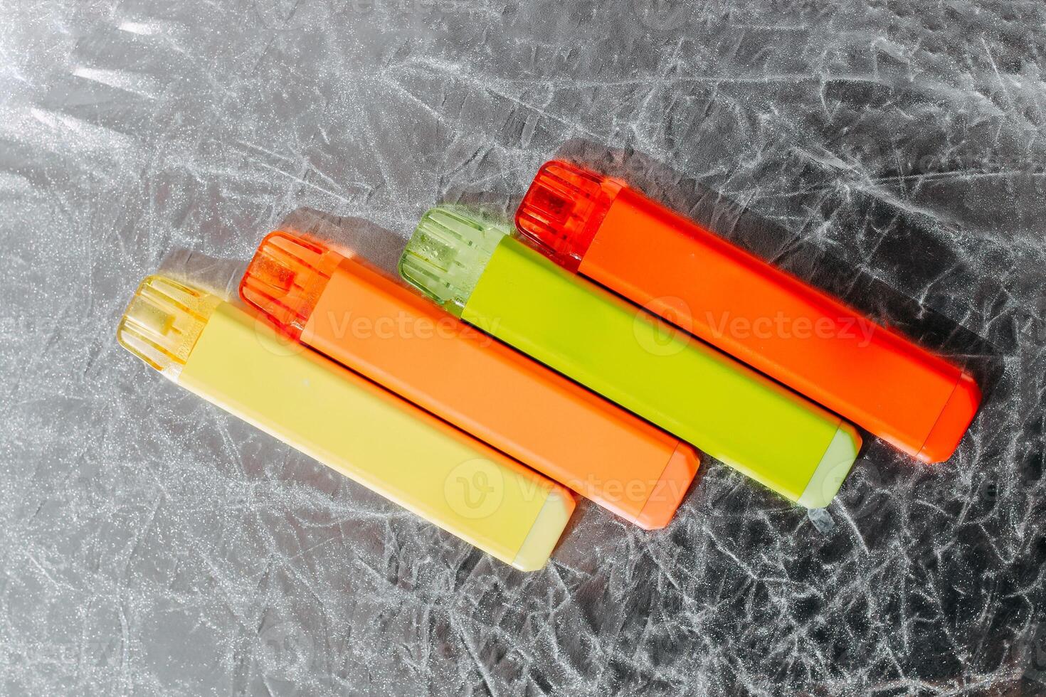 Multicolored multi-use electronic vape cigarettes photo