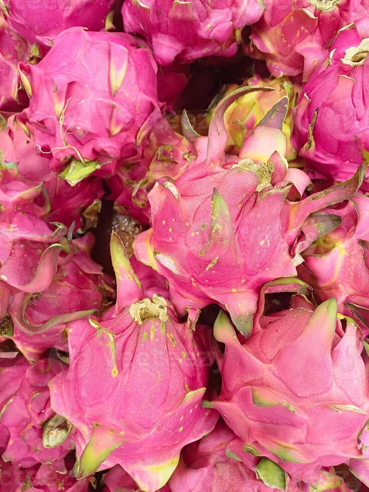 Pitaya. Close up of dragon fruit. Group of Dragon fruit in the Market photo