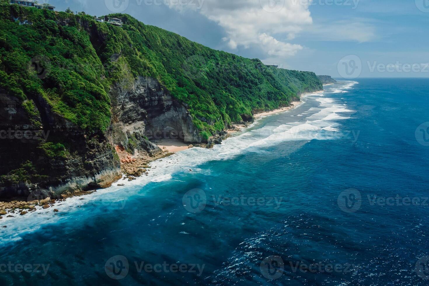 Mountain rocky landscape with coastline and turquoise ocean in Bali. Aerial view photo