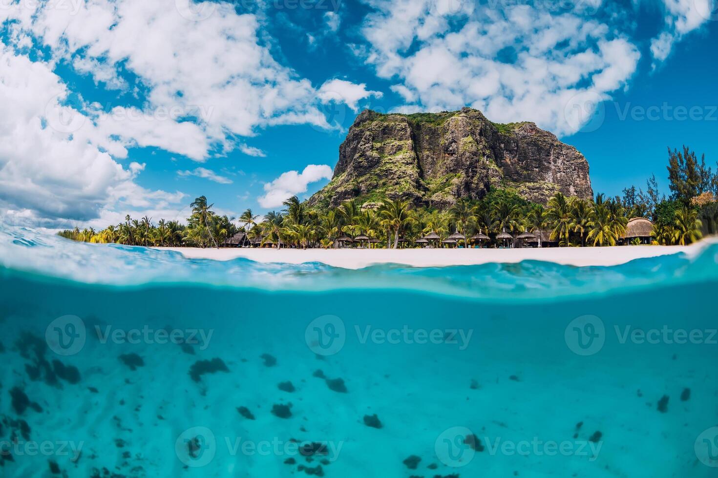 Tropical transparent ocean with Le Morne mountain and luxury beach in Mauritius. Split view. photo