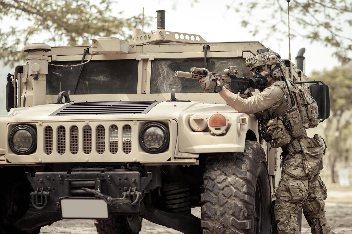United States Army in camouflage uniforms operation in the forest with armored vehicle, soldiers training in a military operation photo