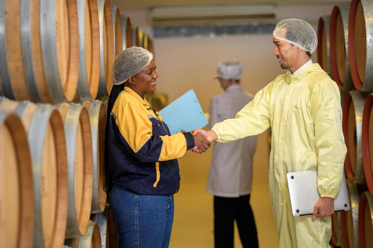 Professional winemaker controlling wine making process and quality at winery factory photo
