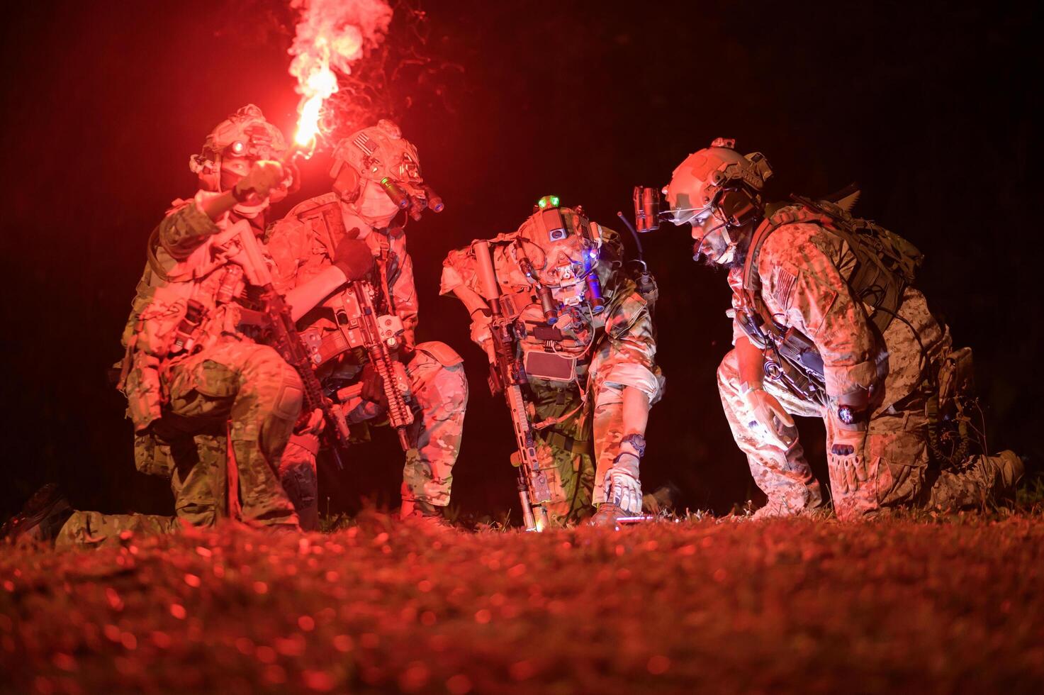 Soldiers in camouflage uniforms aiming with their rifles ready to fire during Military Operation at night, soldiers training in a military operation photo