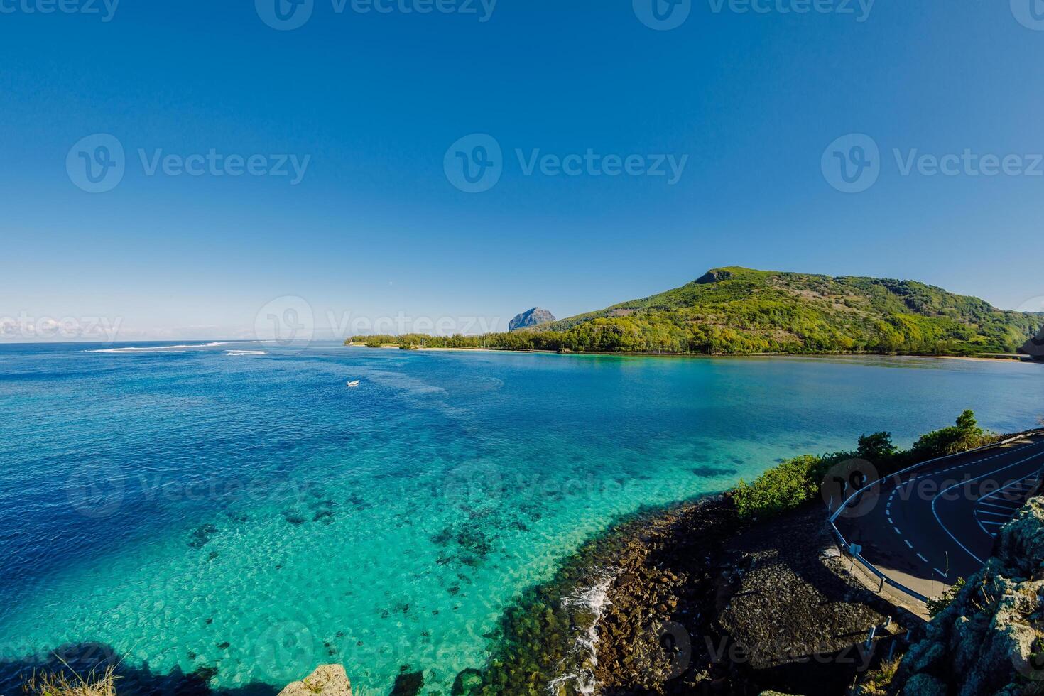 View to Le Morne from Maconde point with ocean and sunlight in Mauritius photo