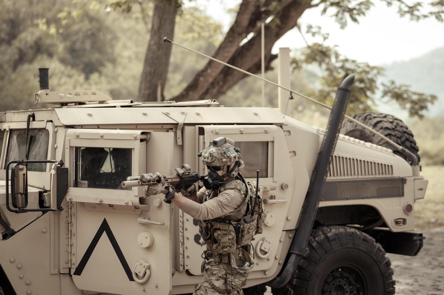 United States Army in camouflage uniforms operation in the forest with armored vehicle, soldiers training in a military operation photo