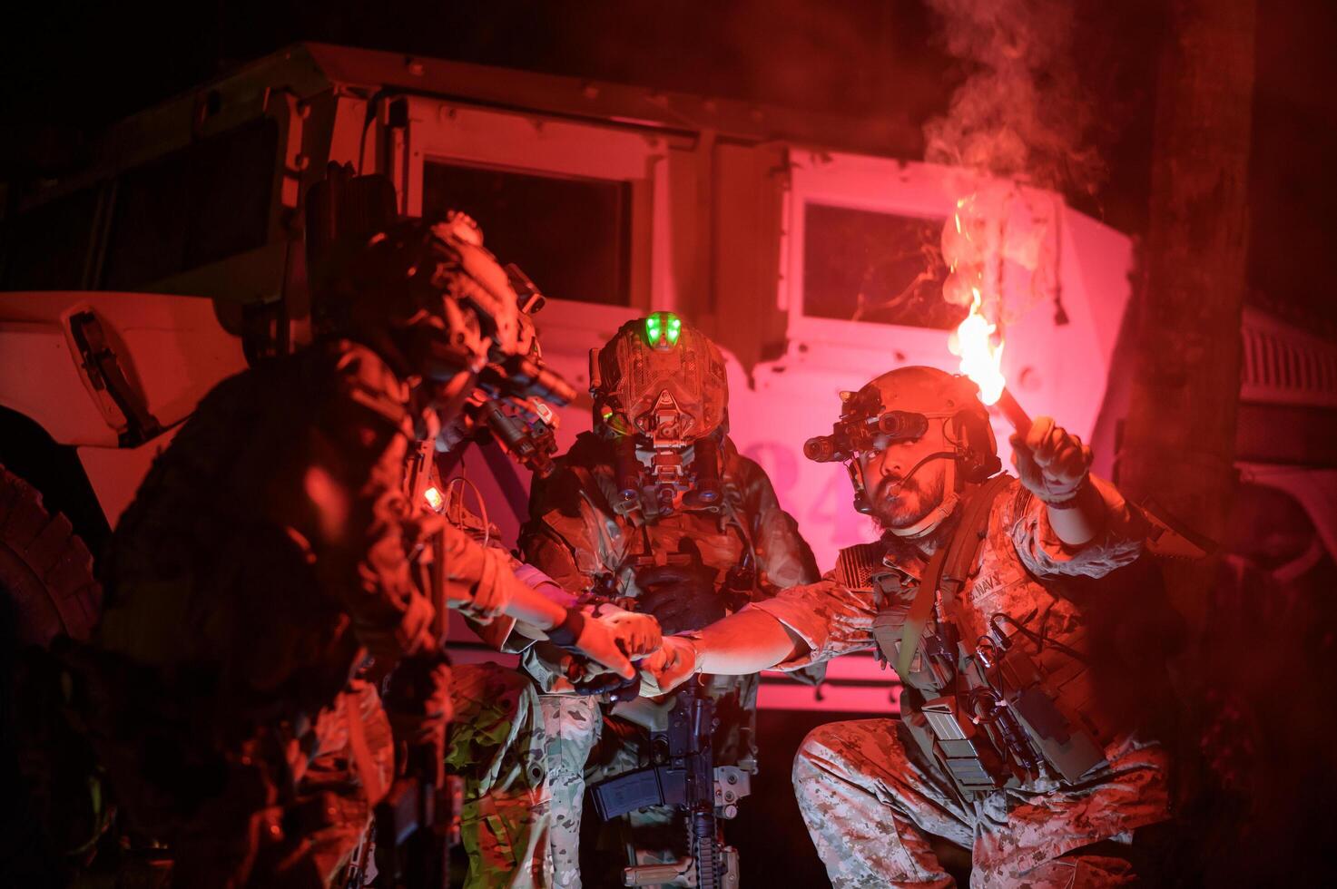 Soldiers in camouflage uniforms aiming with their rifles ready to fire during Military Operation at night, soldiers training in a military operation photo
