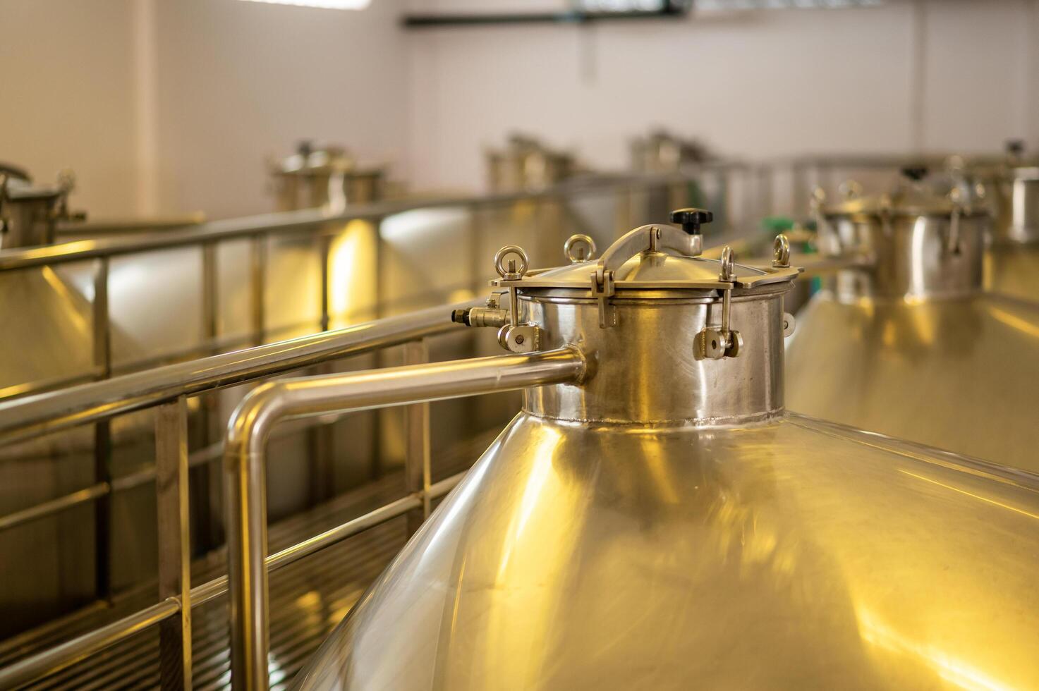 Wine fermentation tanks in modern wine factory photo