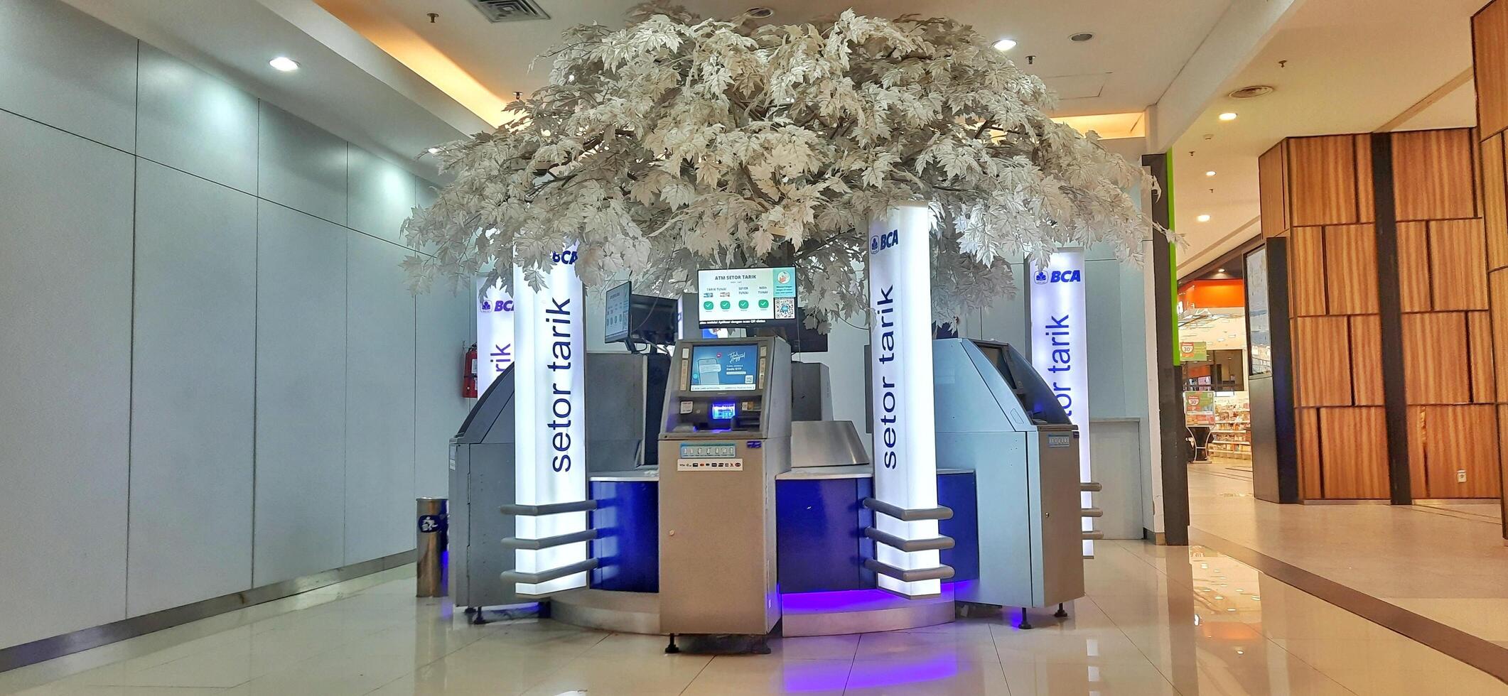 View of Automatic Teller Machine or ATM BCA Bank at AEON Mall Jakarta Garden City. Jakarta Indonesia - April 17 2024 photo