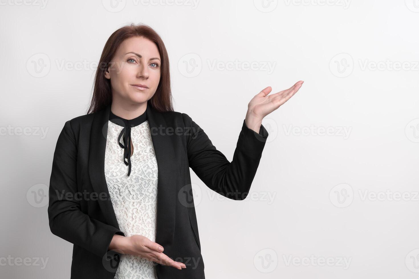 Woman using finger pointing to side with product or blank copy space, standing on white background photo
