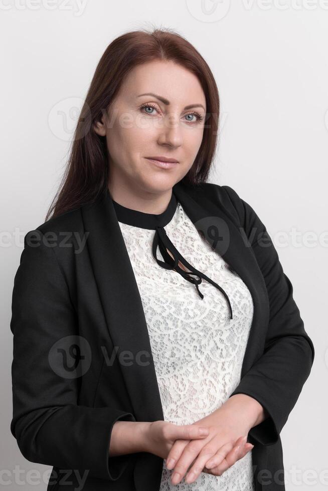 Woman of Caucasian descent, who appears to hold position of creative director looking at camera photo
