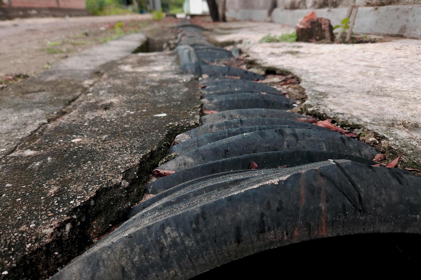 view of a dirt road in a village with a natural concept photo
