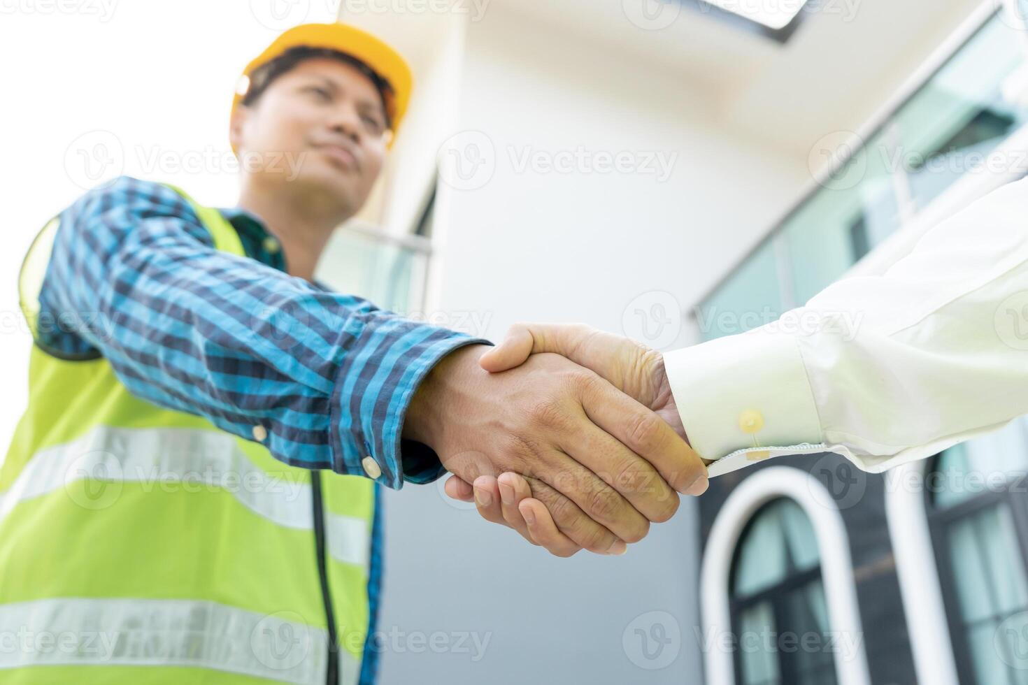 Construction team hands shaking greeting start up plan new project contract in office center at construction site, industry ,architecture, partner, teamwork, agreement, property, contacts. photo
