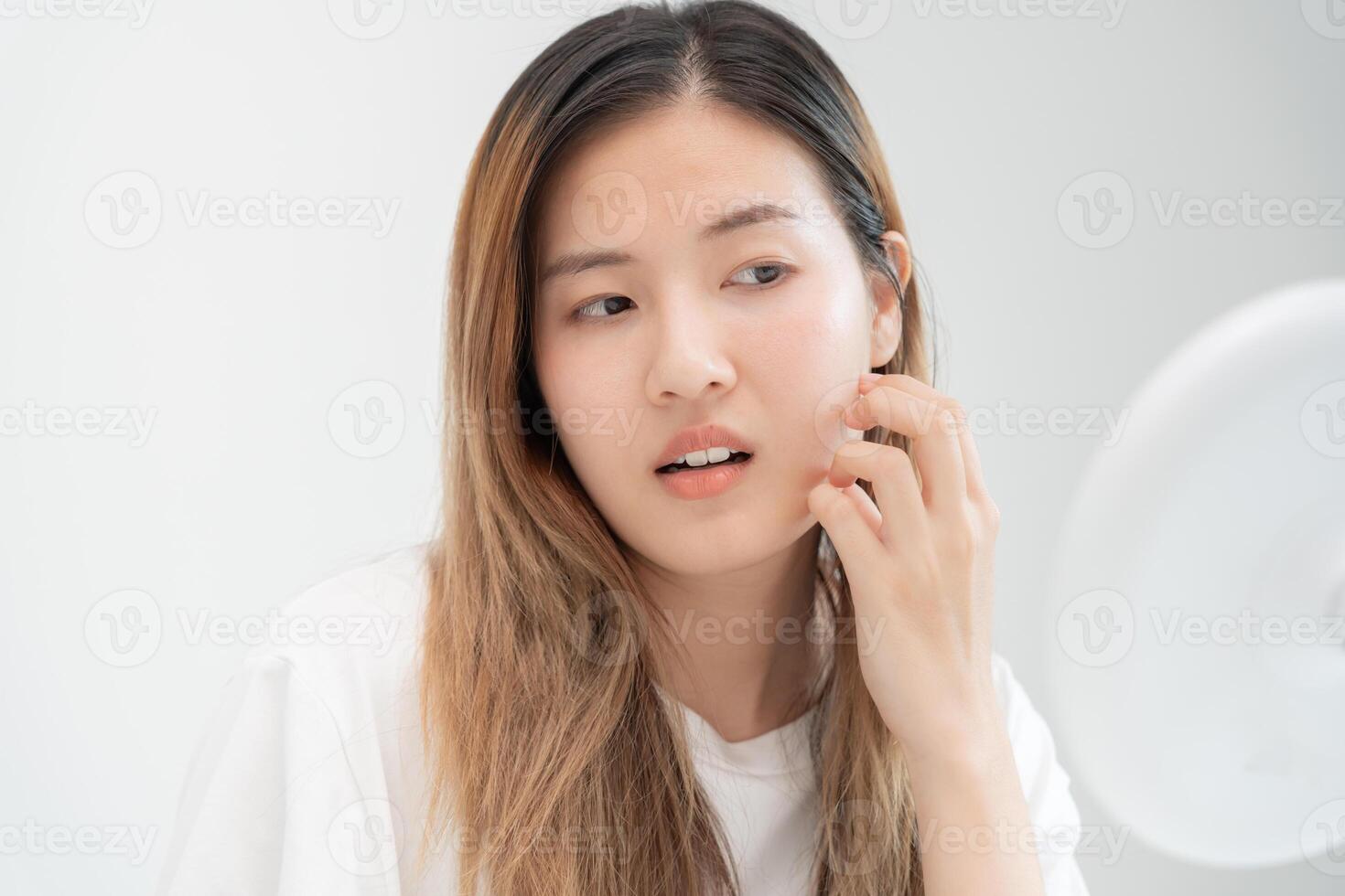Woman worried about face Dermatology, rosacea dermatitis, allergic steroids, sensitive skin, red face from sunburn, acne, dry skin, large pores ,rash face, dull, freckles, wrinkle, skin problem photo