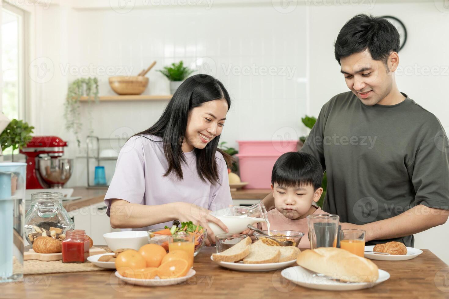 family time, breakfast, activities together during the holidays. Parents and children are having a meal together during the holidays. New home for family on morning, enjoy, weekend, vacant time photo
