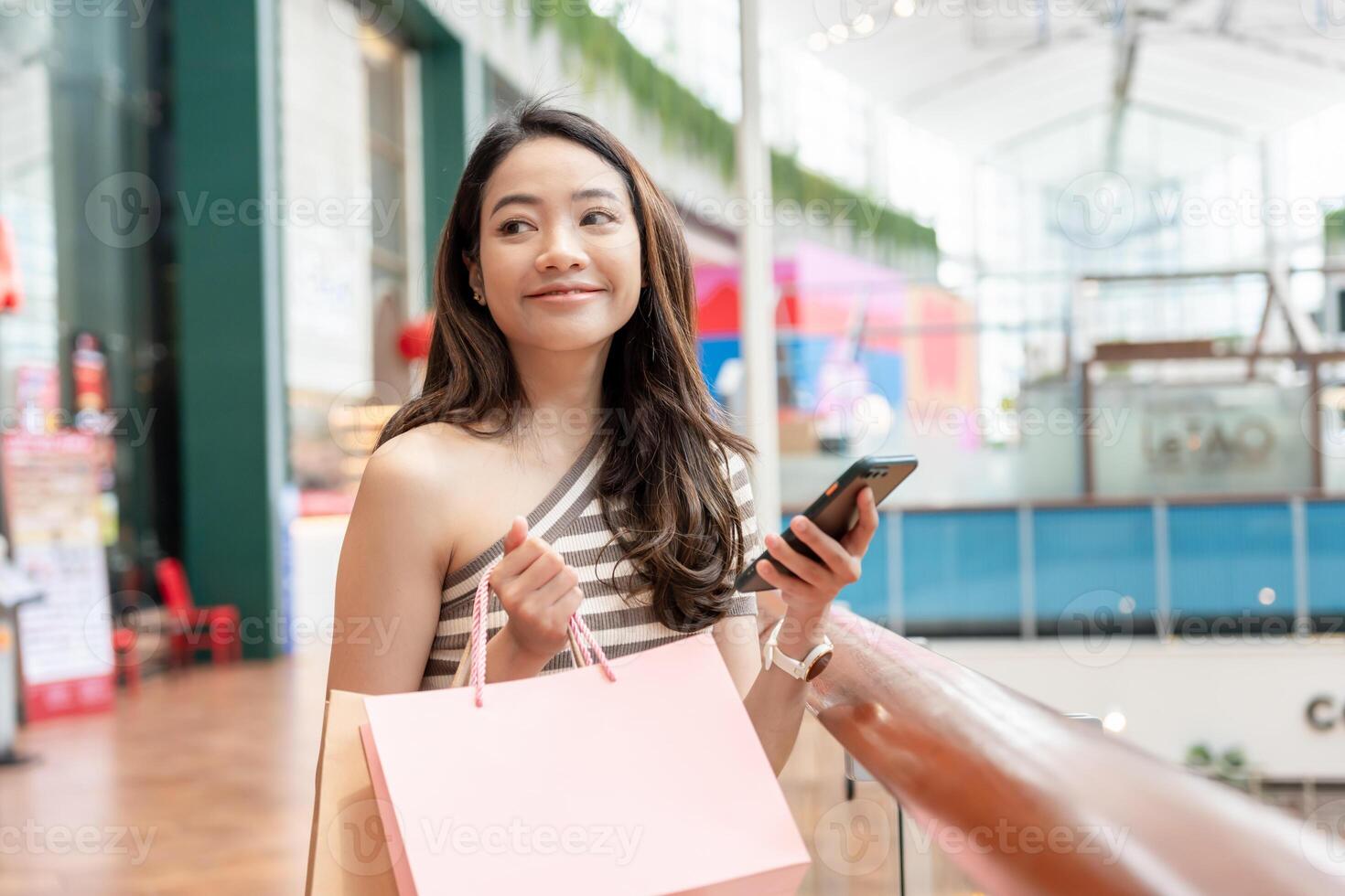 woman using smartphone for online shopping at home. Hand holding mobile phone with payment detail page display and credit card, stay home, technology, electronic commerce, internet, market place photo