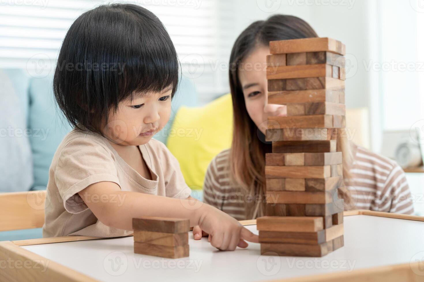 Happy Asia children play and learn toy blocks.family is happy and excited in the house. daughter having fun spending time, Activity, development, IQ, EQ, meditation, brain, muscles, essential skills. photo
