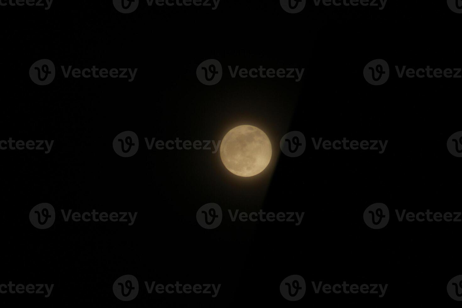 the full moon in the black sky photo