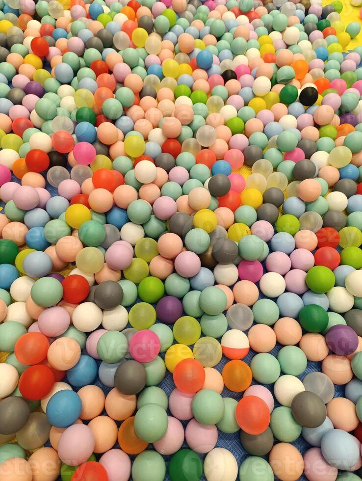a close up of a colorful plastic ball with a colorful top. Children's playground photo