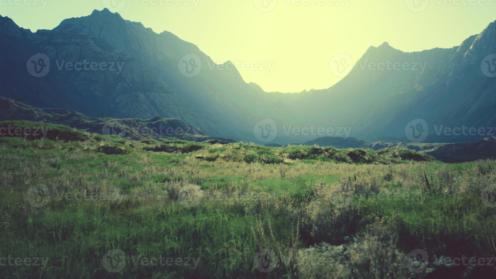 rocky arid mountain landscape with little vegetation and dry grass photo